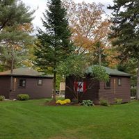 The Pines Cottage Resort logo